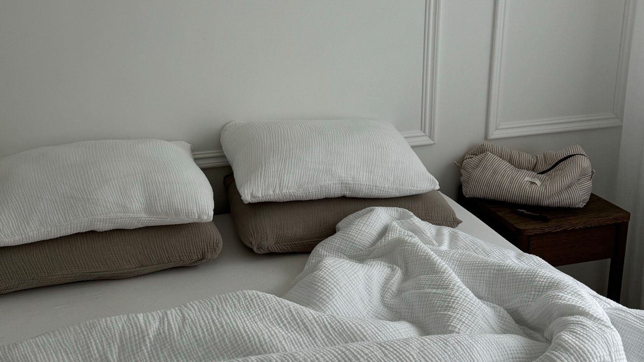 Bright minimalist bedroom interior in white tones